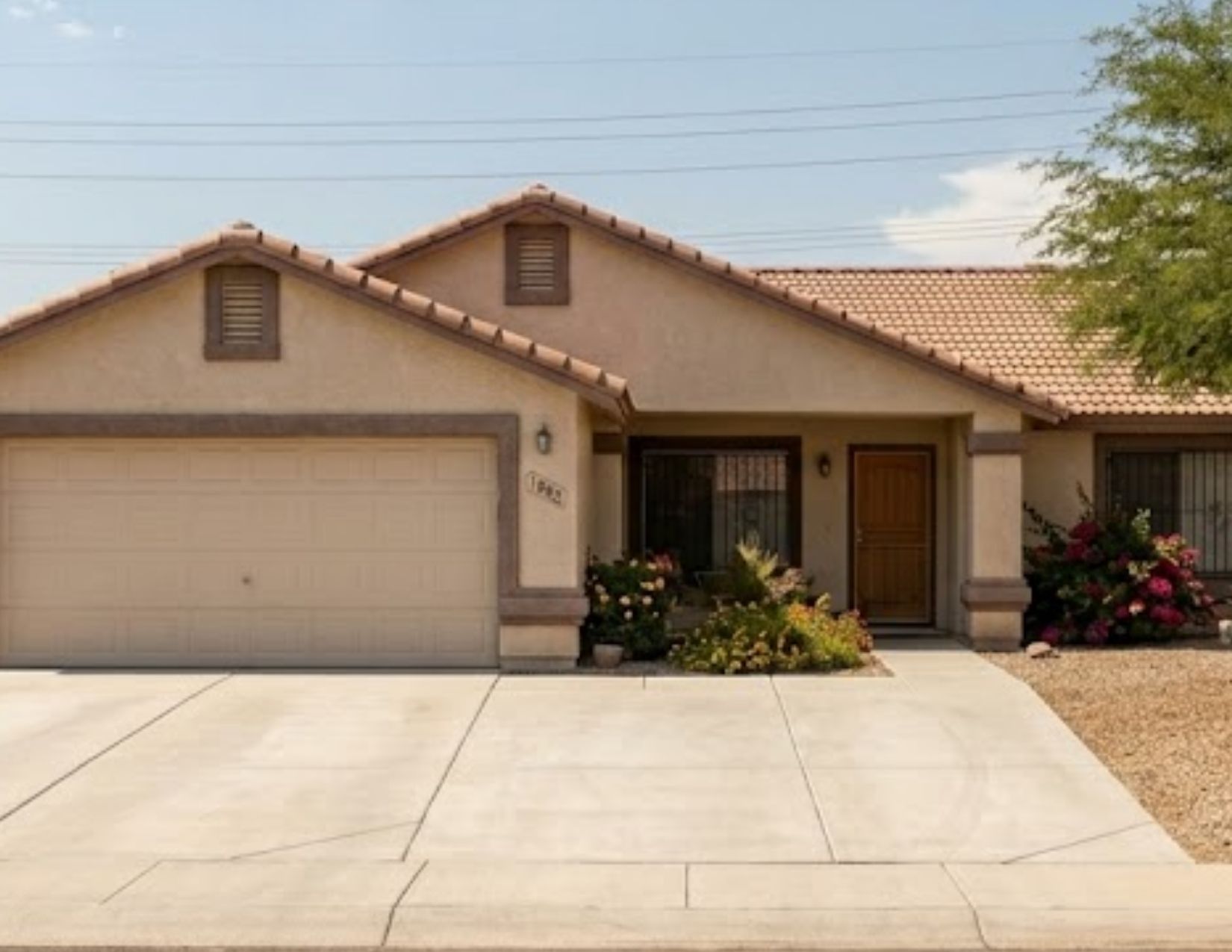 Same Yuma driveway after Brennan's power washing — same day